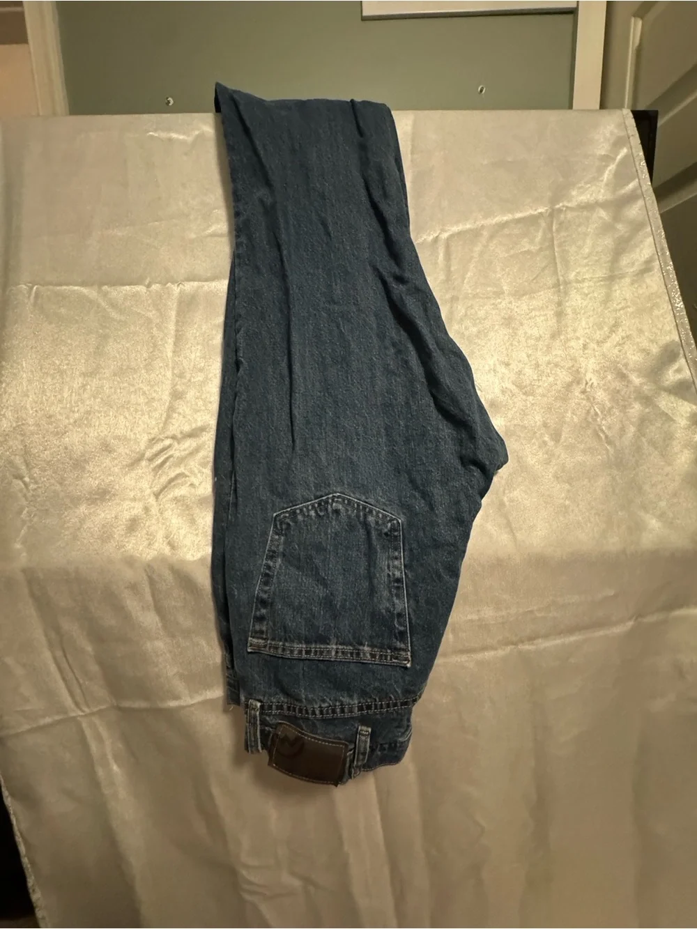 Magellan Outdoors Men’s Relaxed Blue Denim Jeans with Brown Patch